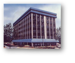 A large building with a blue awning on the side