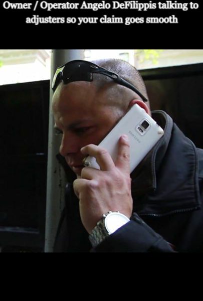 A man wearing sunglasses is talking on a cell phone