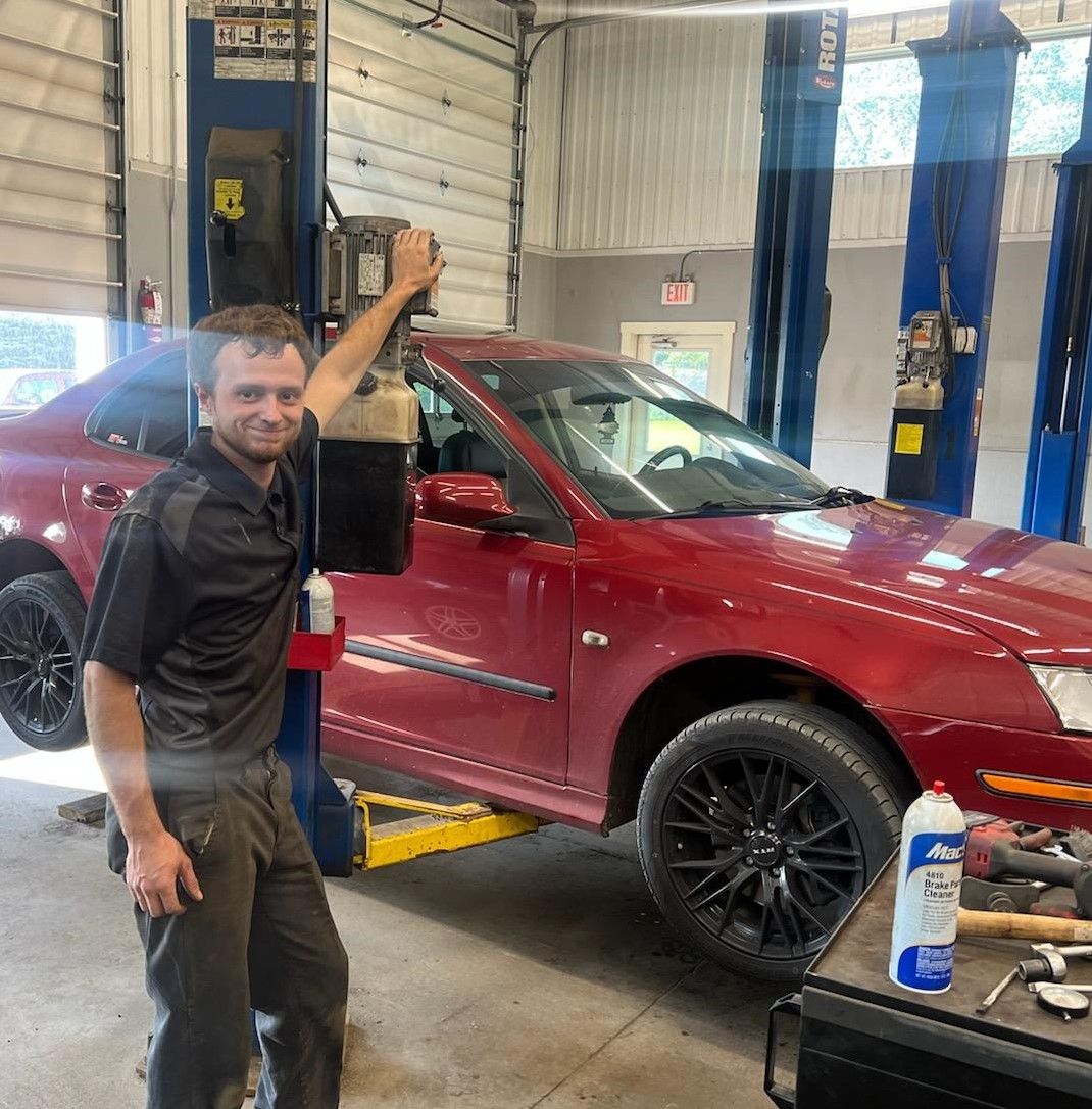 Car in lift | J.S. Automotive