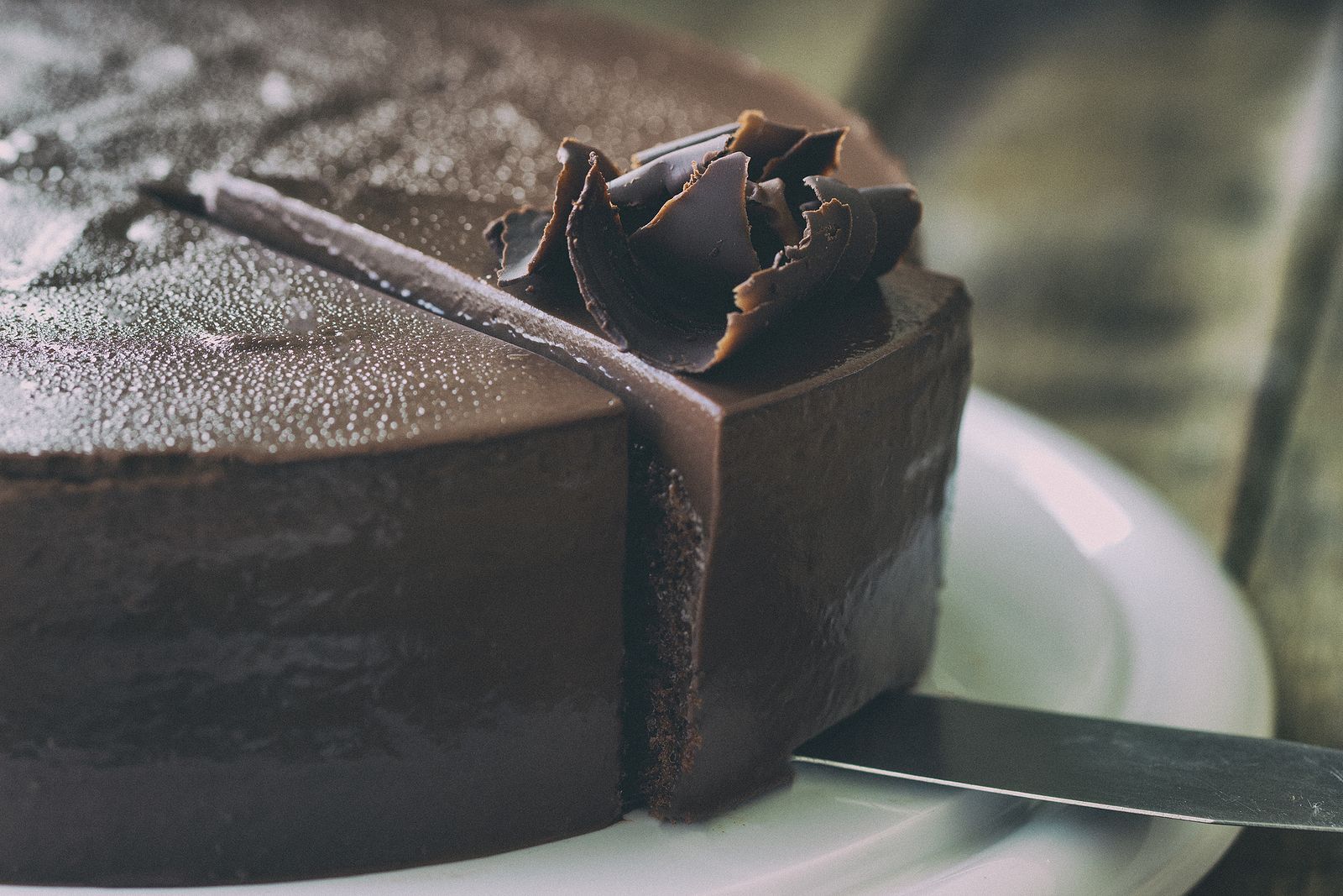 A chocolate cake with a slice taken out of it