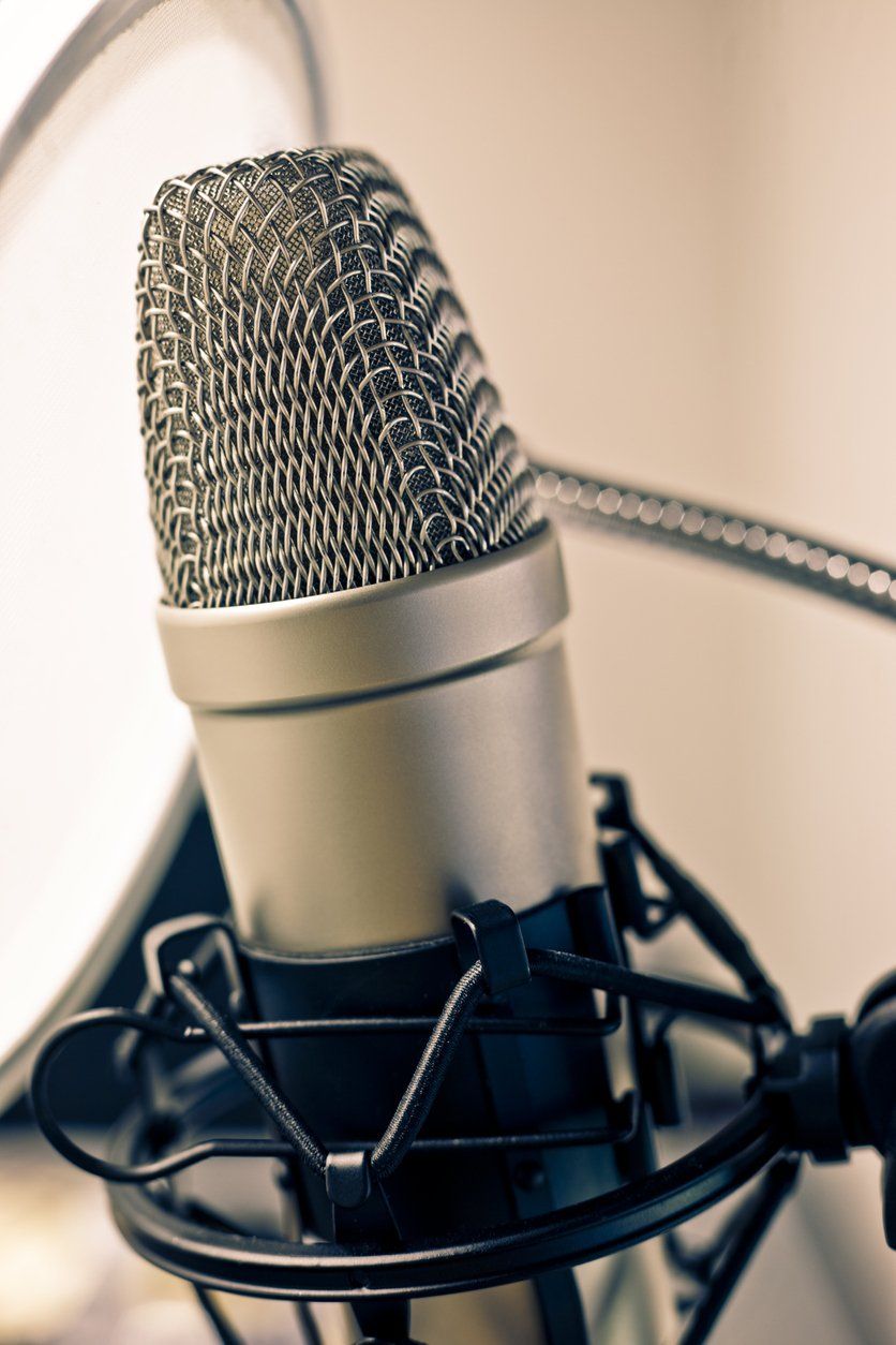 A close up of a microphone used in recording virtual events