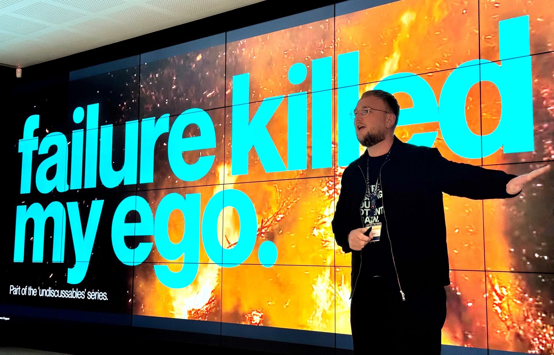 Keynote session graphic: Leaders, dinosaurs, and rebellion. People stand with dinosaurs, bold text, and a vintage style.