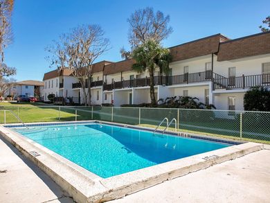 A large swimming pool in front of a building