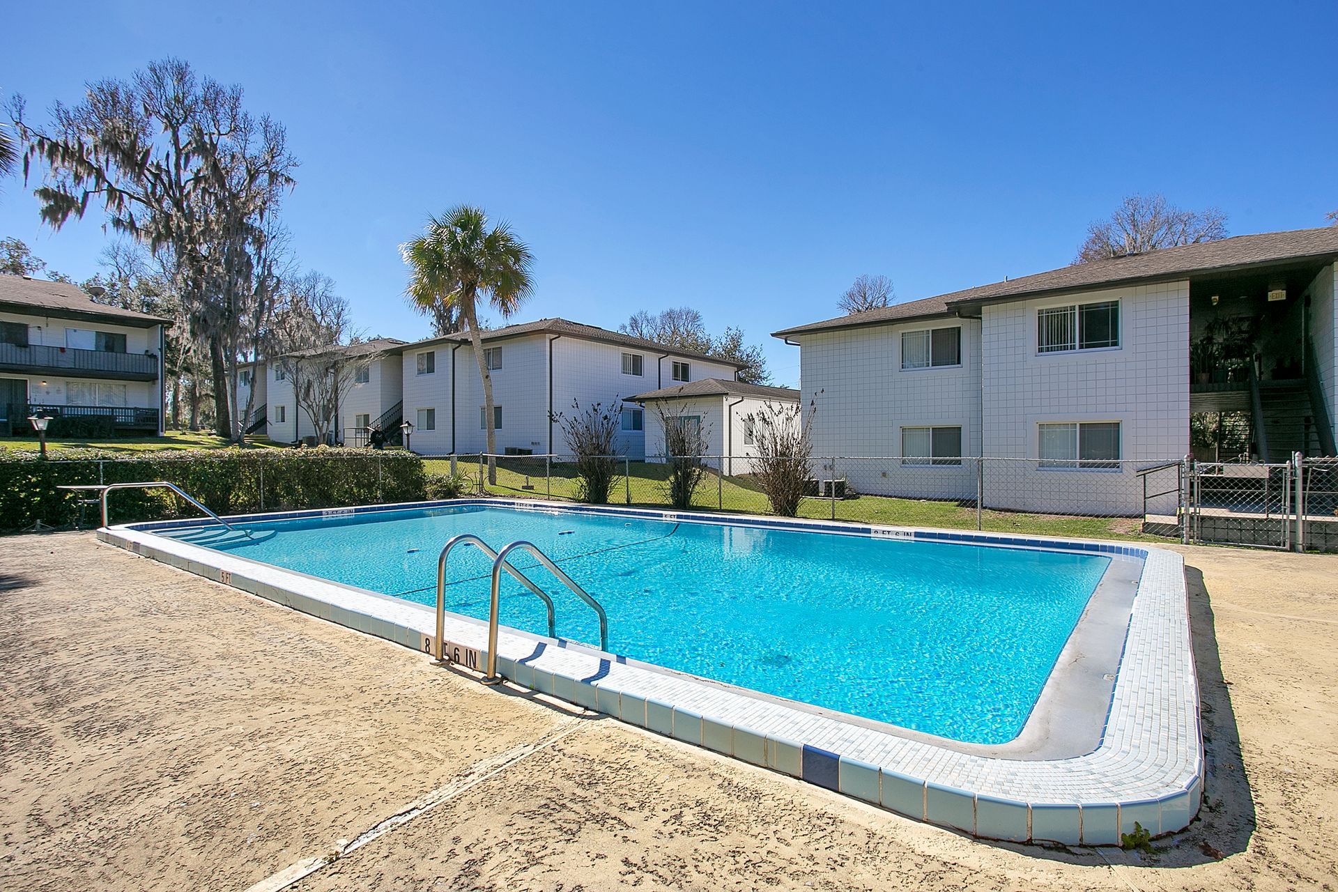 A large swimming pool in front of a building