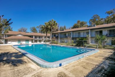 A large swimming pool in front of a building