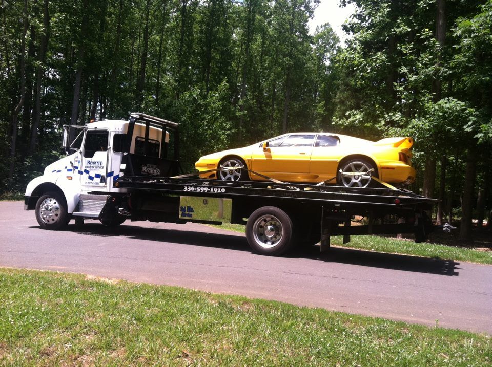 Hauling Yellow Car — Roxboro, NC — Brann’s Wrecker Service Inc