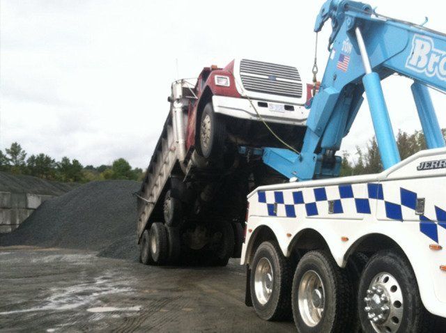 Towing a Red Truck — Roxboro, NC — Brann’s Wrecker Service Inc