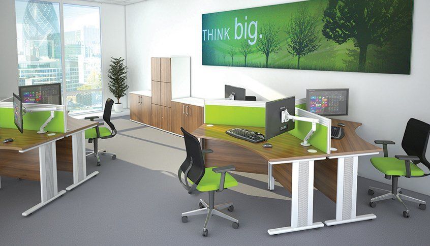 Green themed office with a wall photo saying Think big