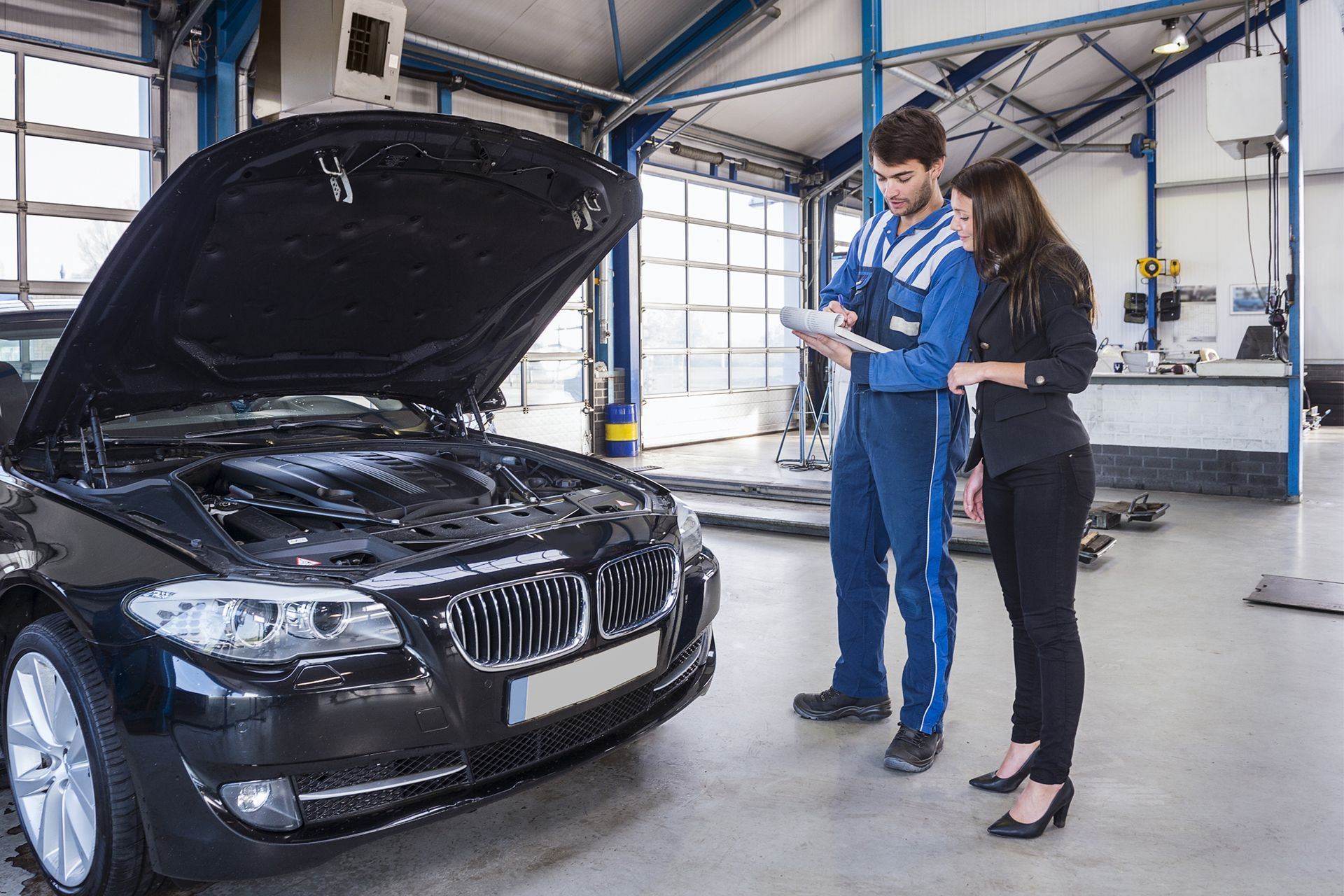 Car Owner With Auto Mechanic