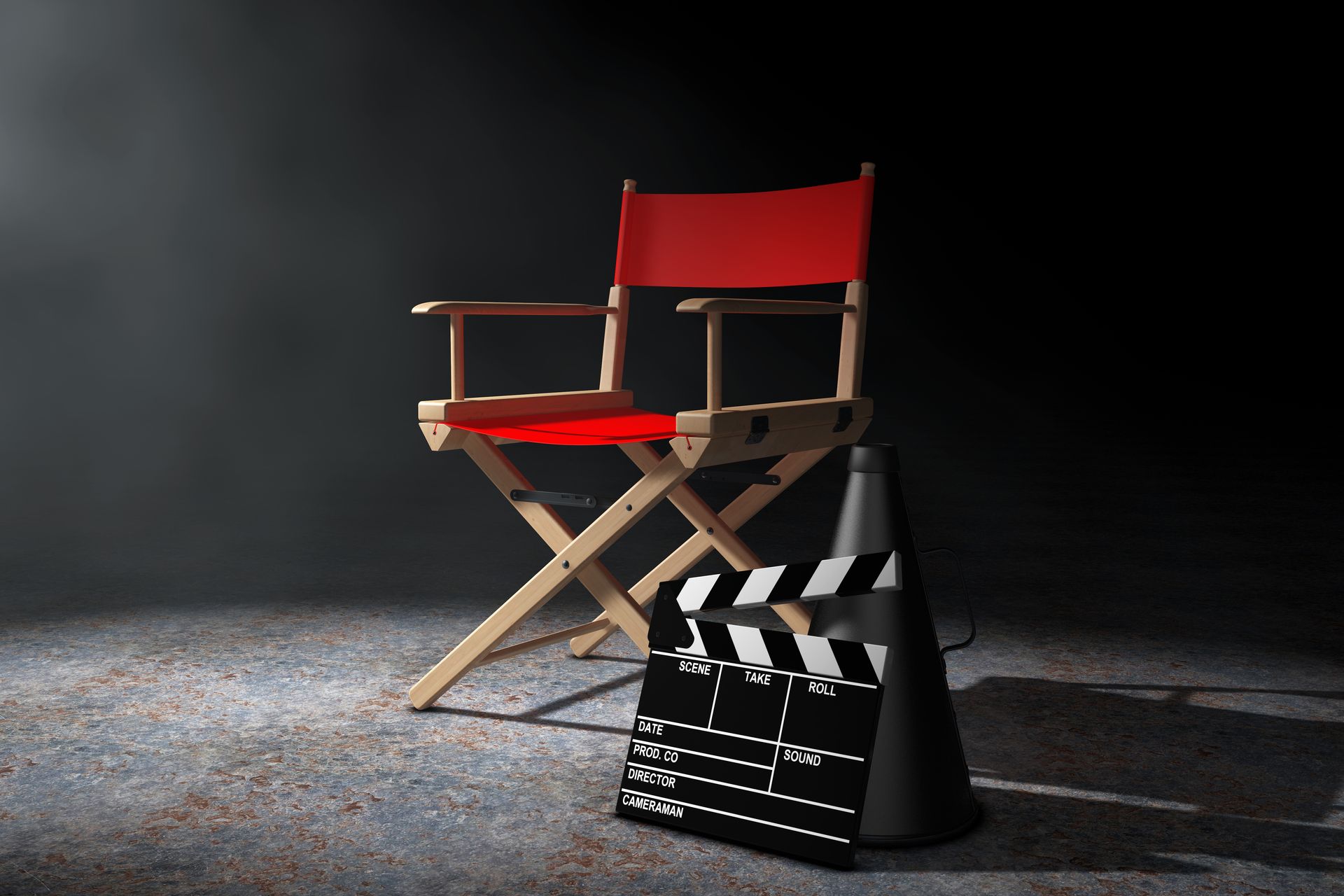 A director 's chair is sitting next to a clapper board and a cone.