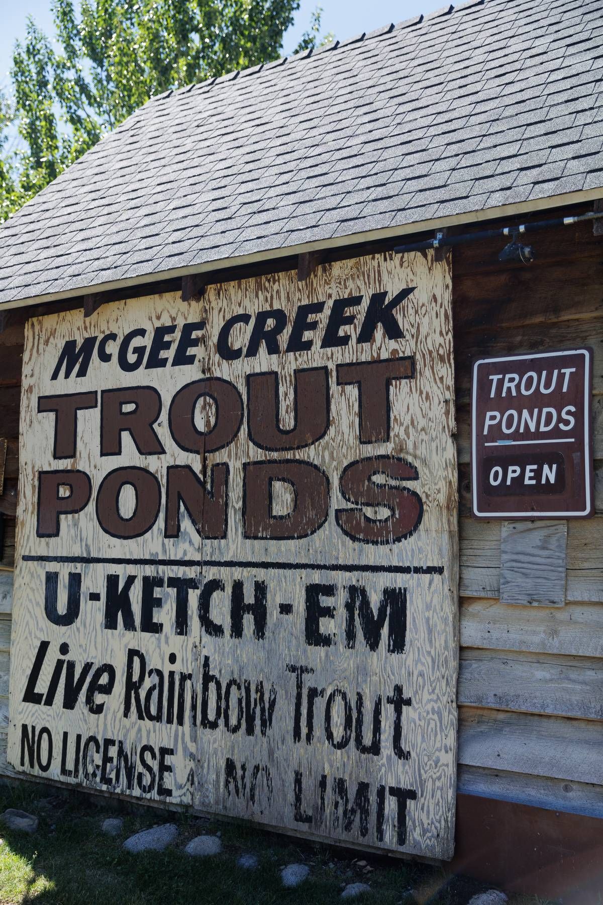 A sign that says mcgee creek trout ponds on it
