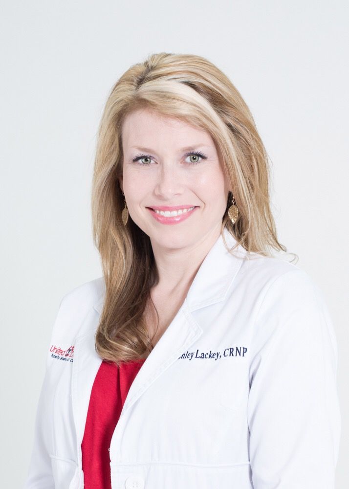 Ashley Lackey, CRNP - female nurse practitioner in white coat
