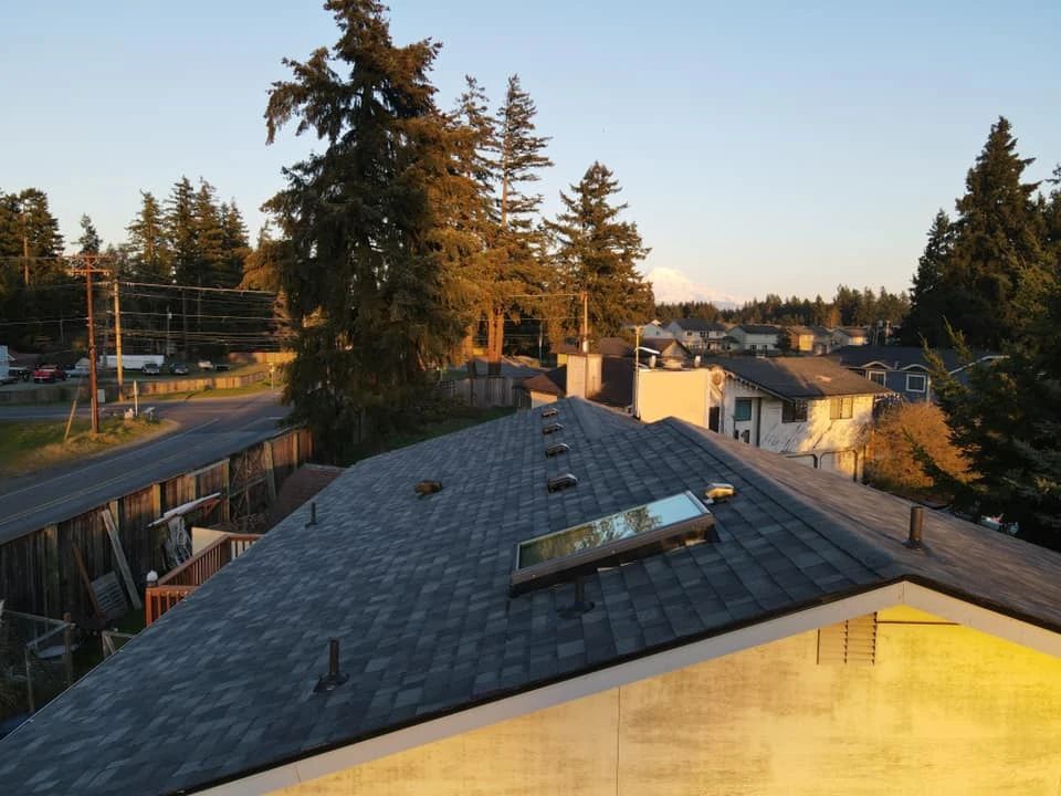The roof of a house has a skylight on it