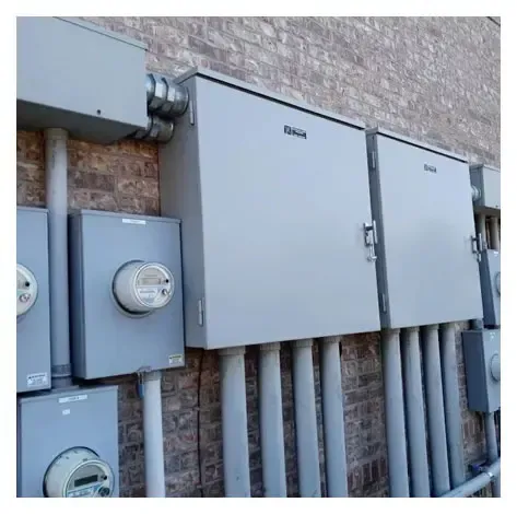 A row of electrical boxes on the side of a building.