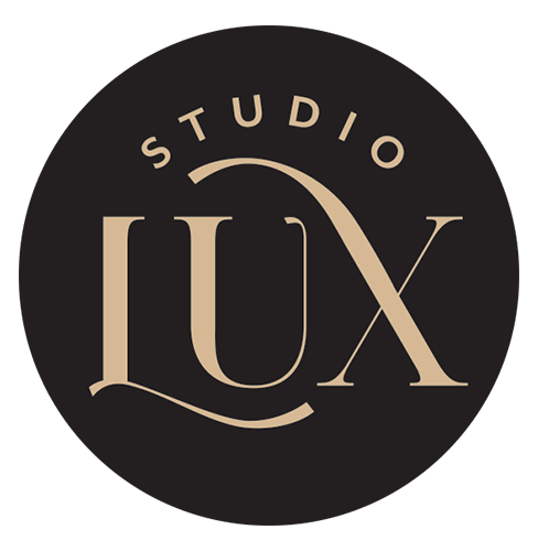 Studio LUX logo in a black circle. Gold lettering "STUDIO" above, "LUX" below with an arch.