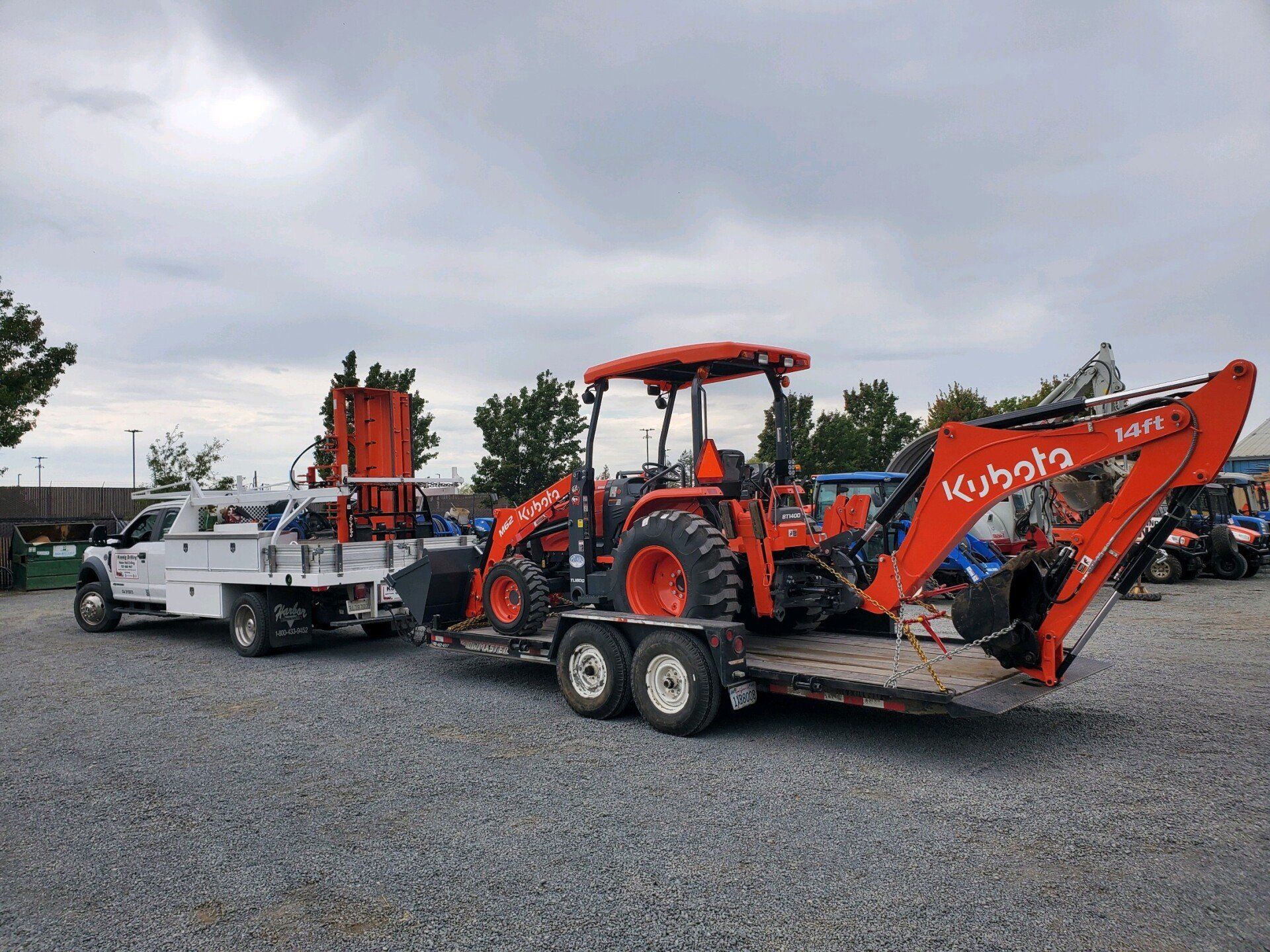 Truck Carrying Backhoe Loader - Sonoma, CA - Koenig Drilling
