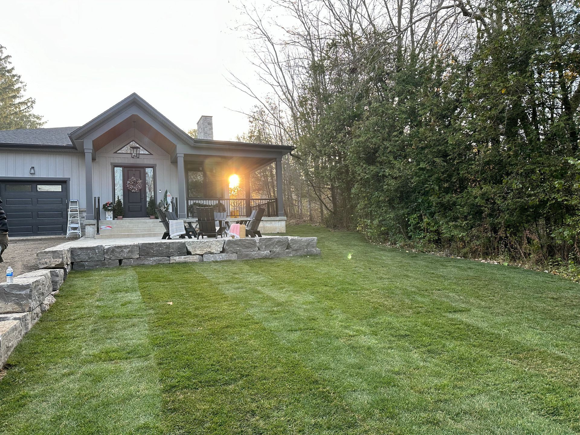 A house with a large lawn in front of it.