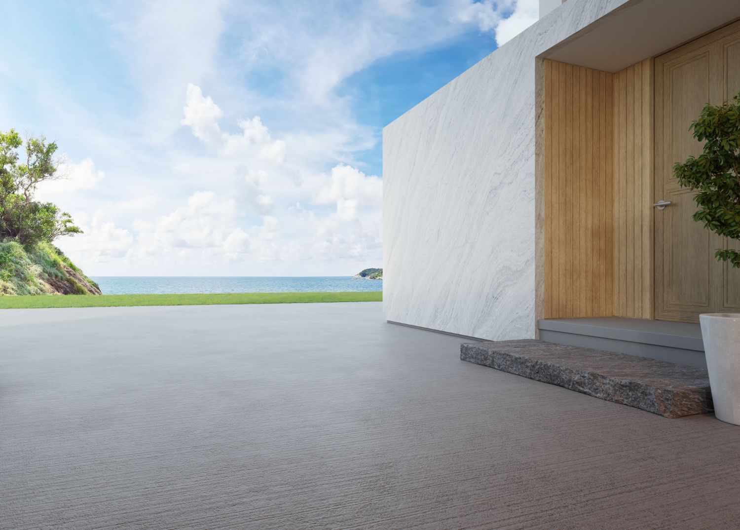 A white house with a wooden door and a view of the ocean.