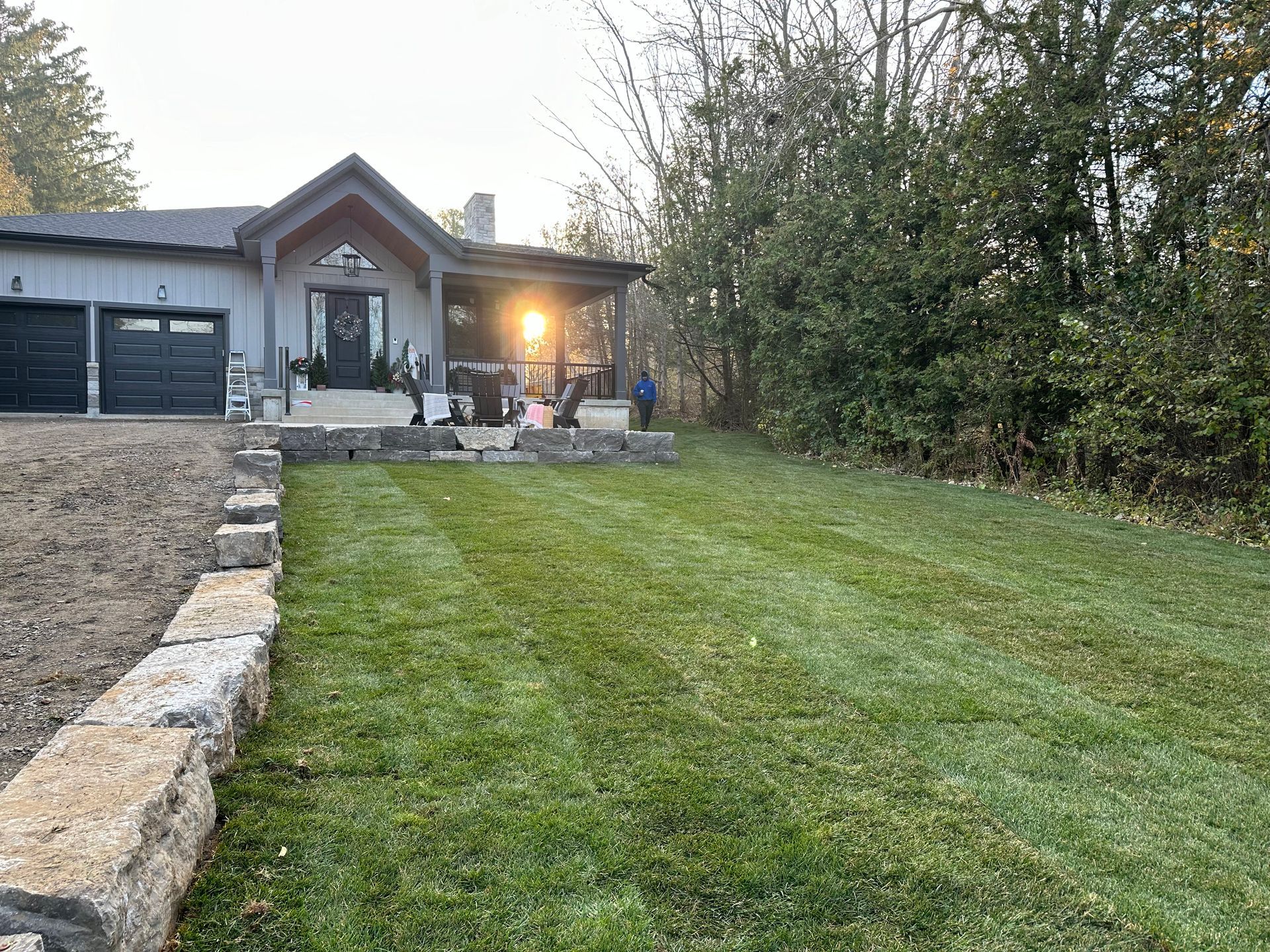 a house with a large lawn in front of it .