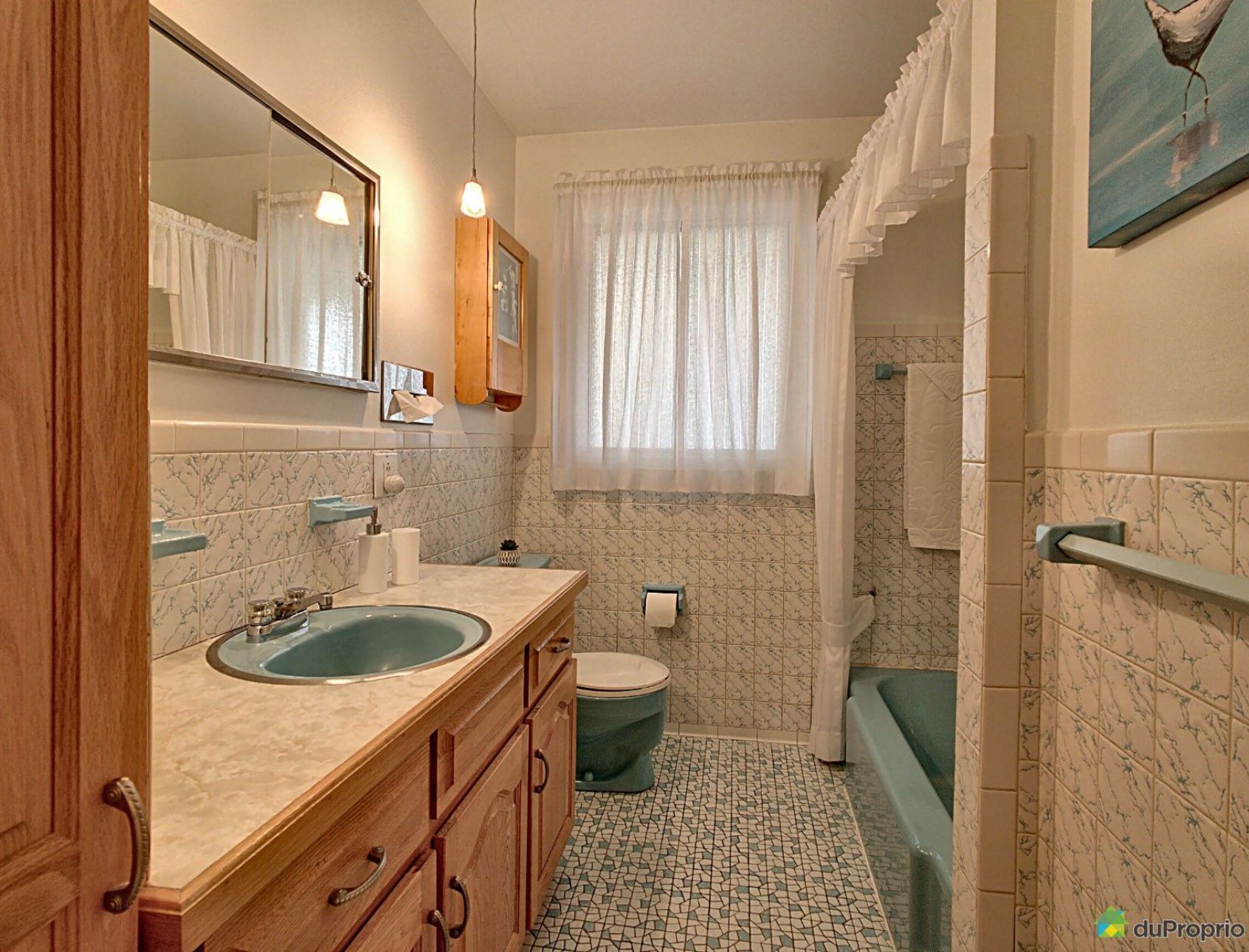 A bathroom with a sink a toilet and a bathtub