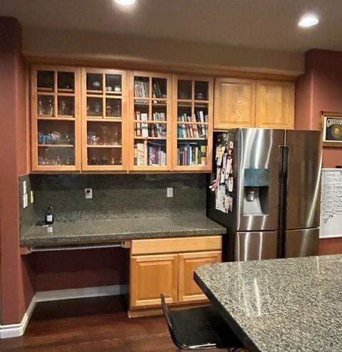 A kitchen with stainless steel appliances and granite counter tops