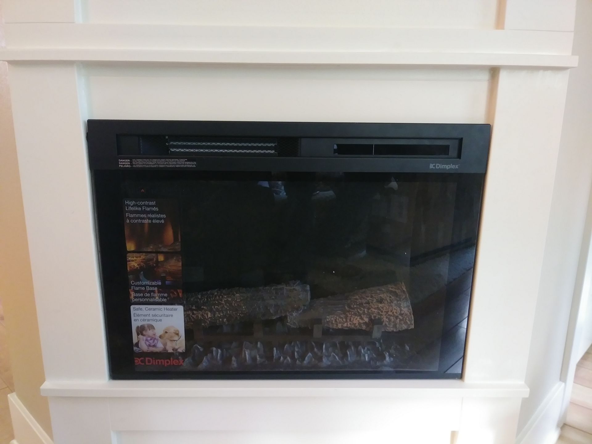 A fireplace with a sticker on it that says ' netflix ' on it