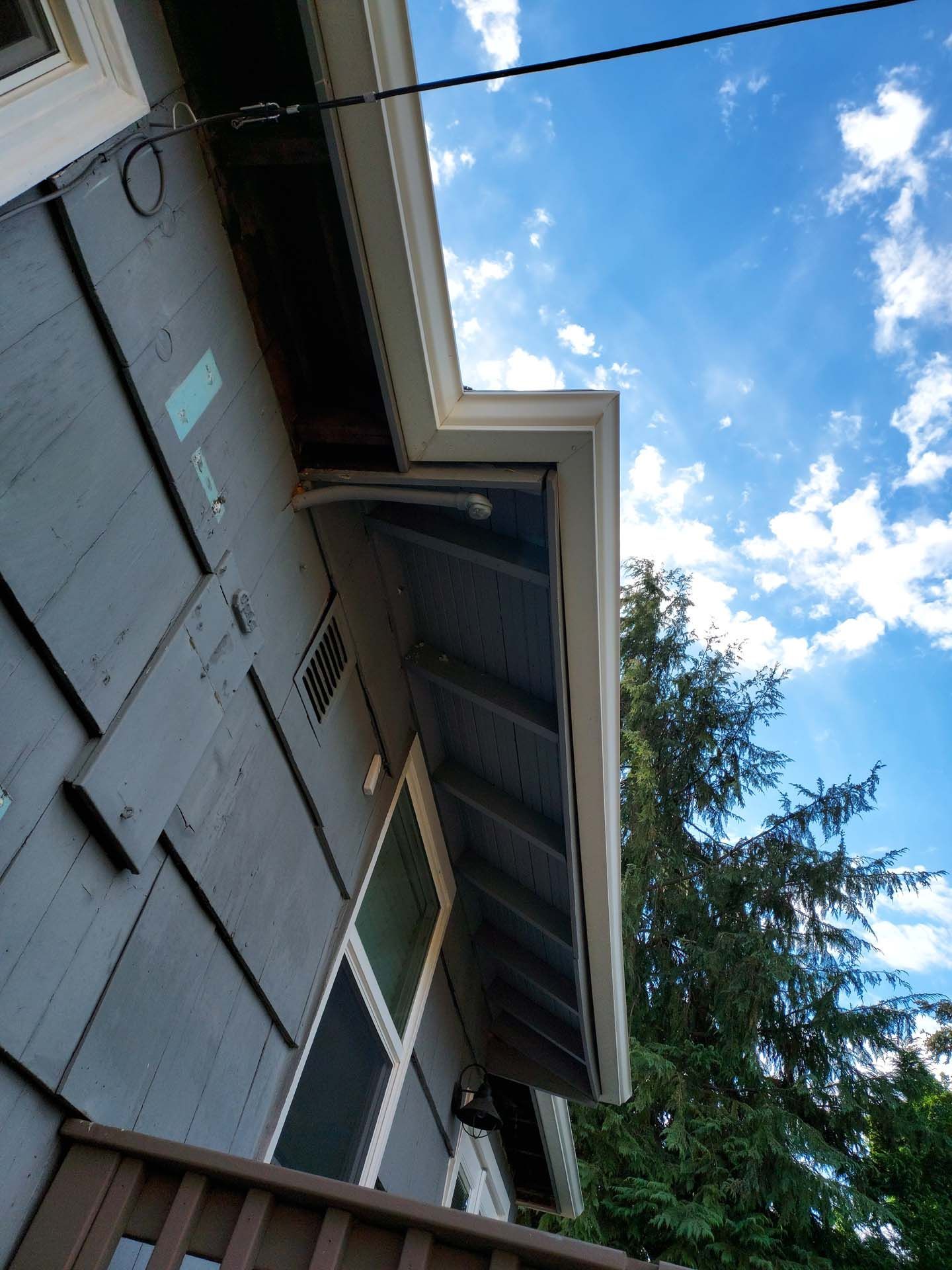 Looking up at a house with a blue sky in the background