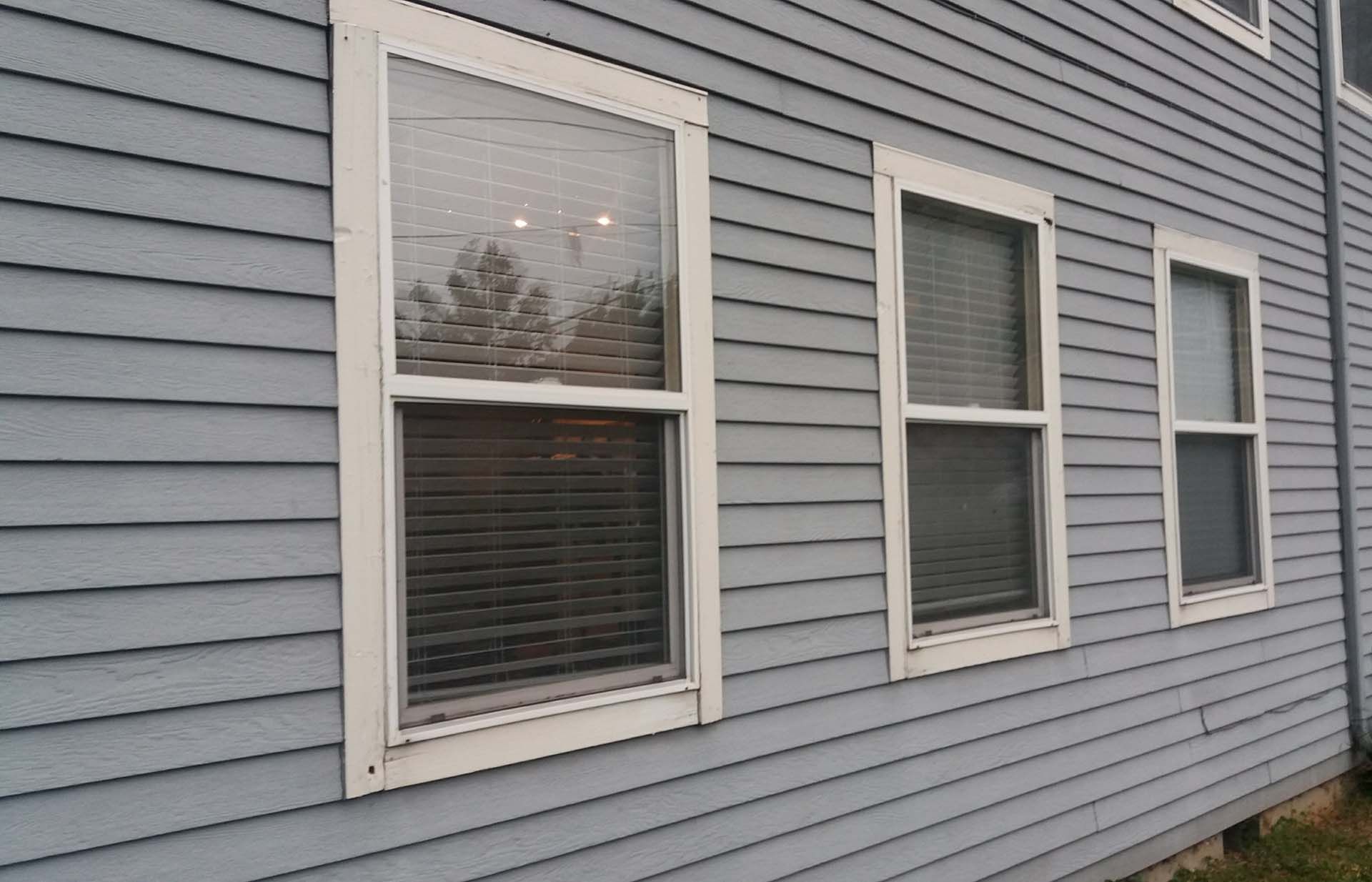 A row of windows on the side of a house