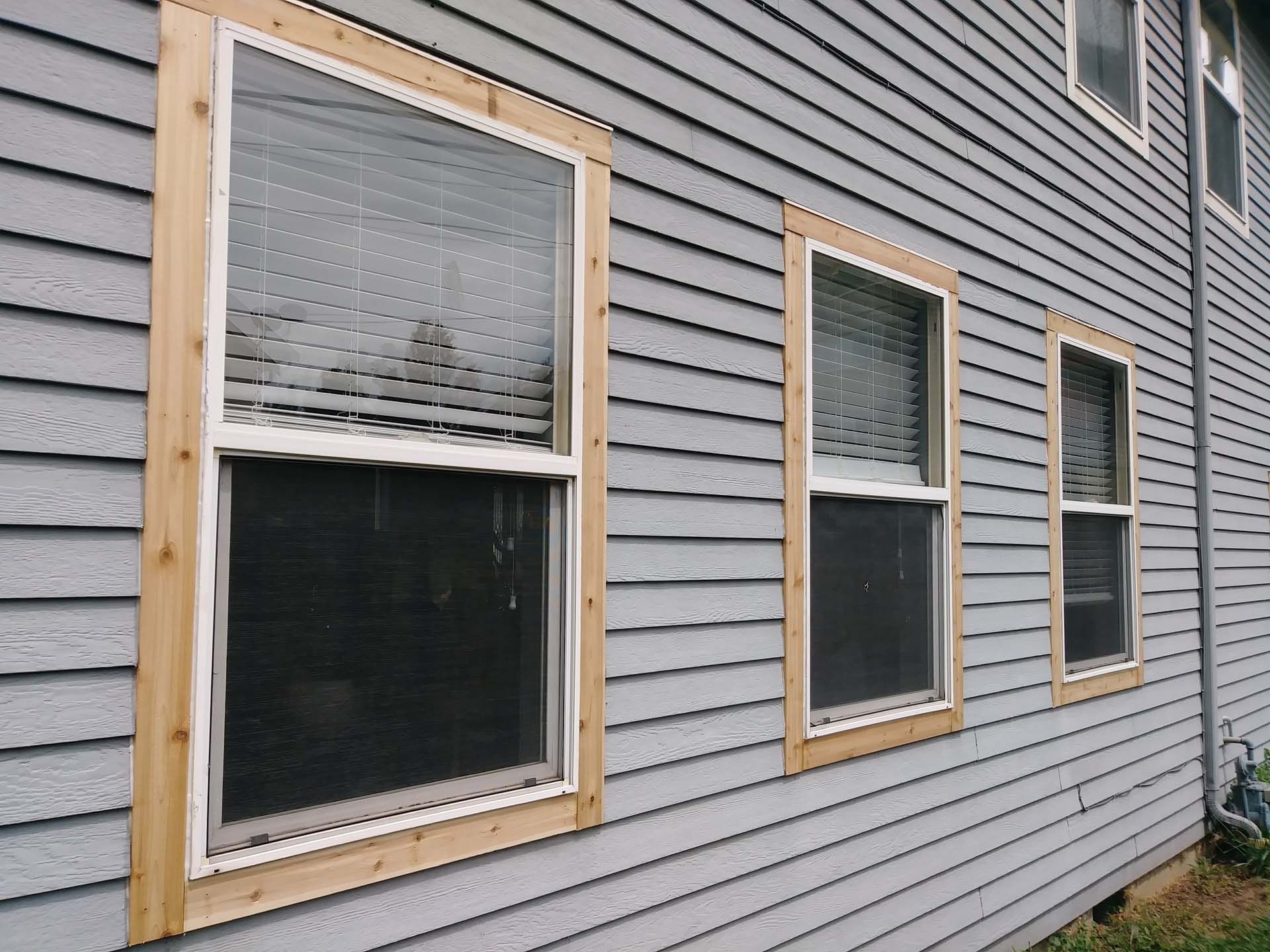 A row of windows on the side of a house