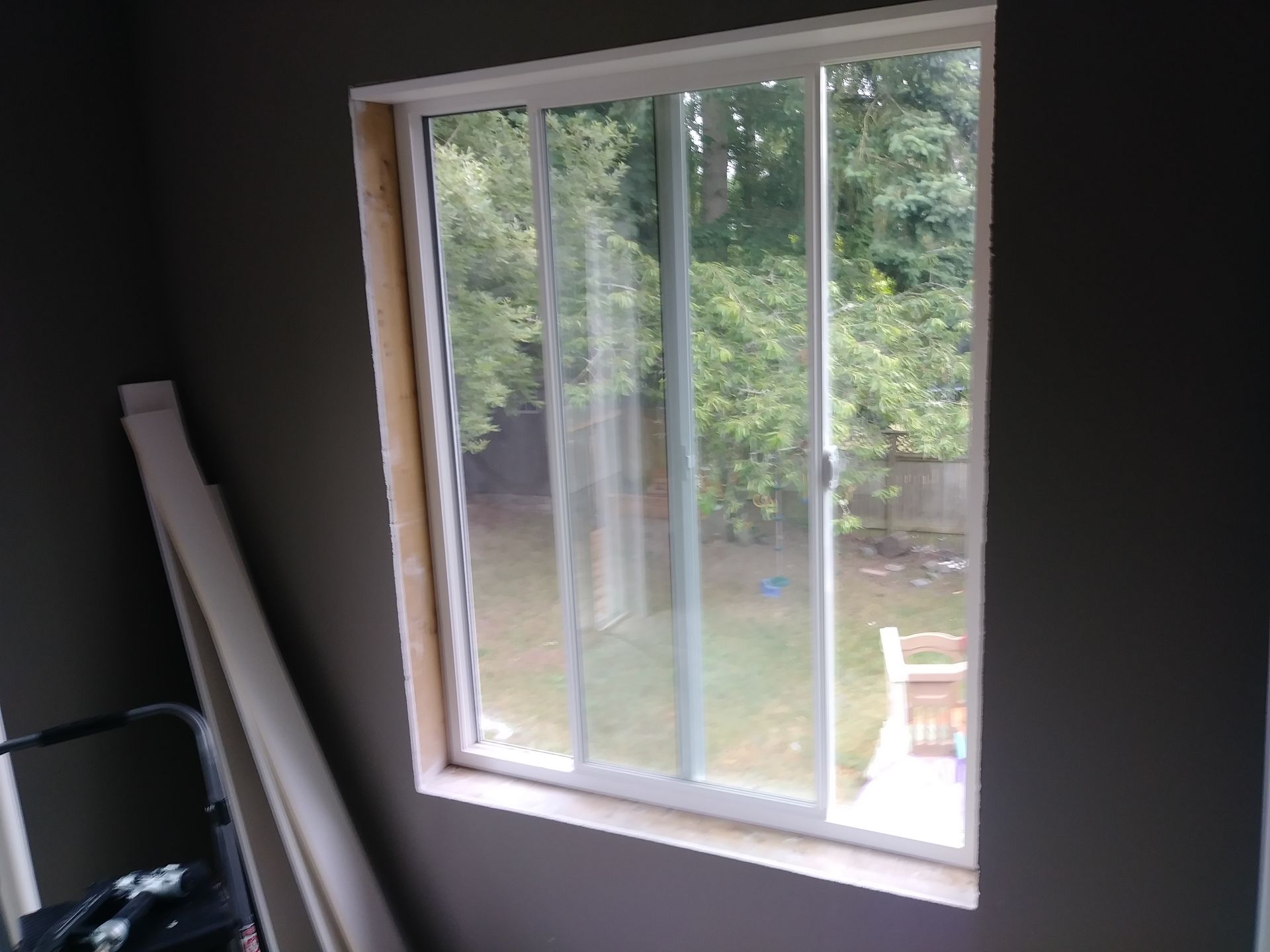 A window with a sliding glass door in a room