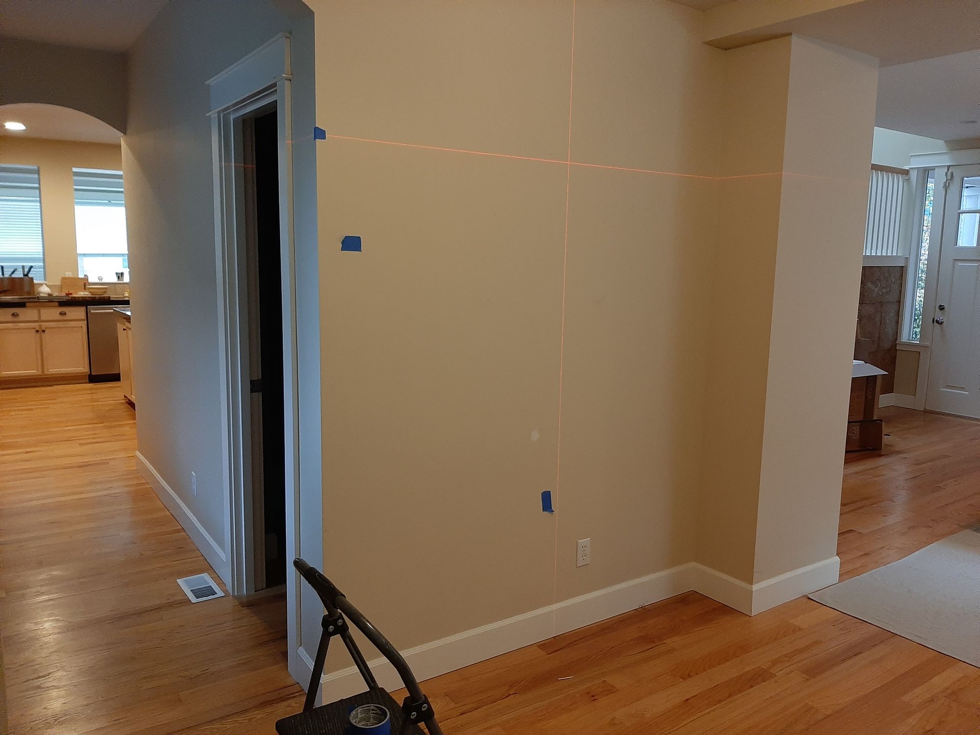 A chair is sitting in a hallway next to a door.