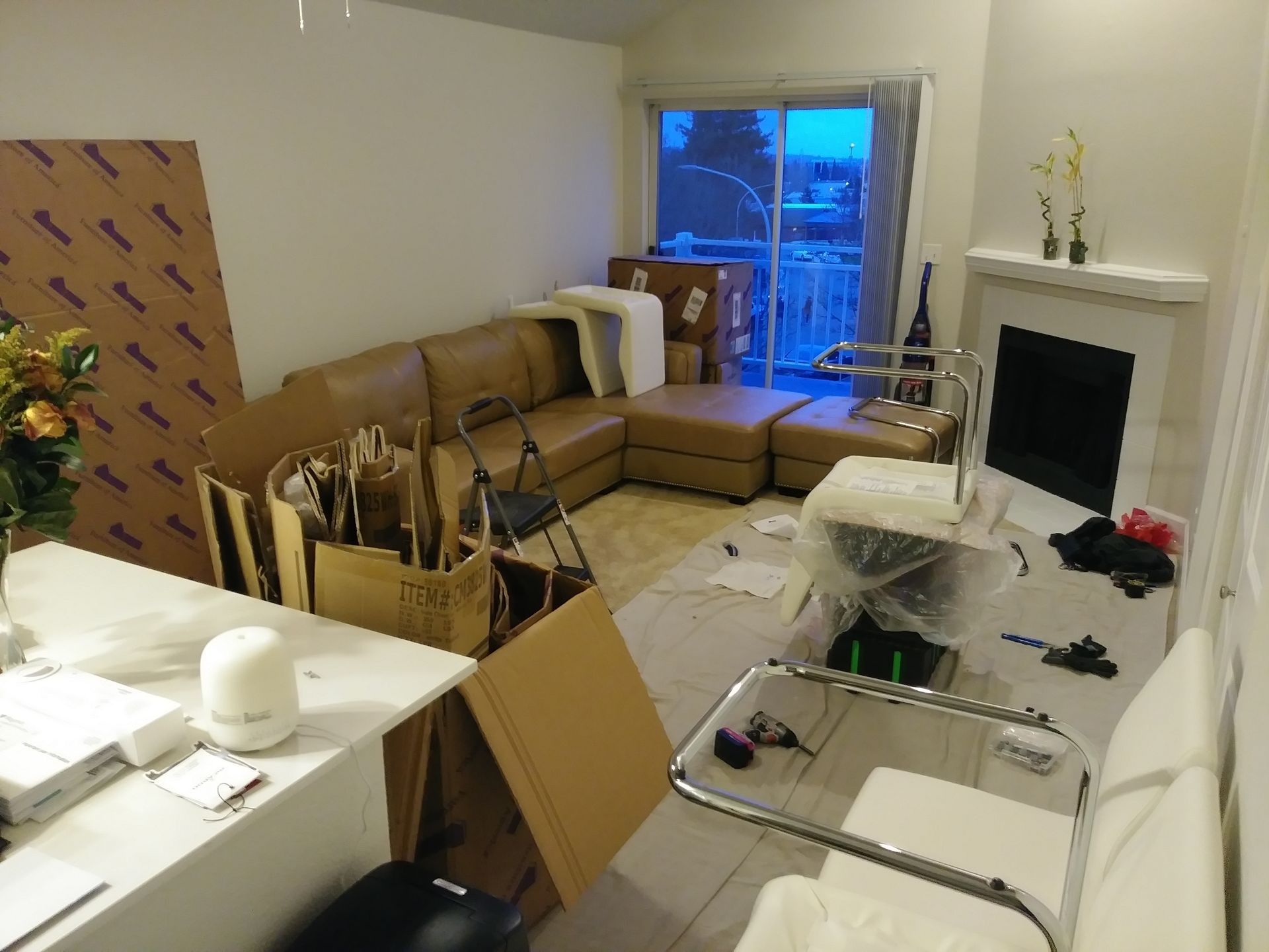 A living room with a couch and a fireplace