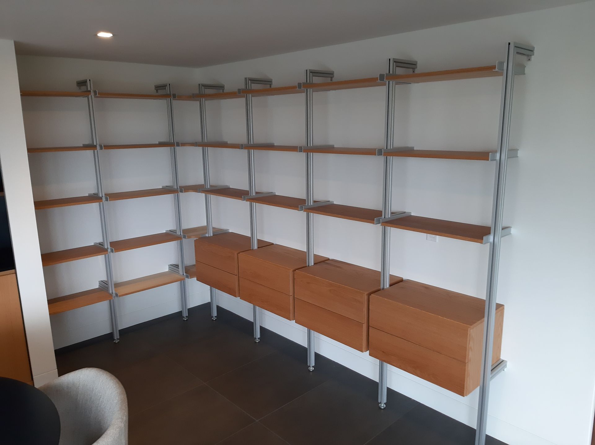 A room with a lot of shelves and drawers