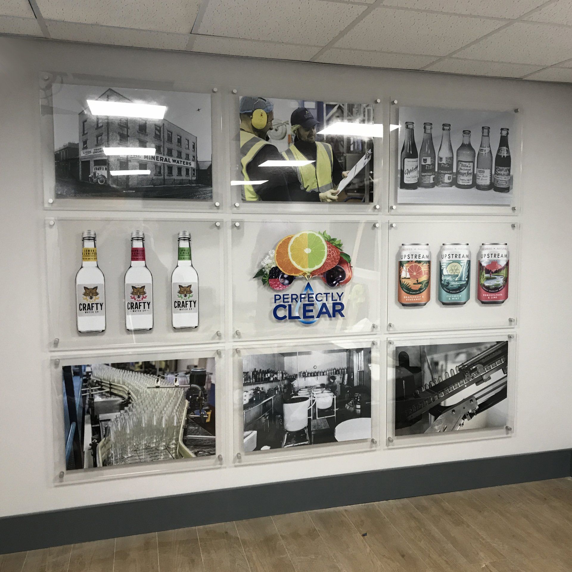 A wall with a bunch of pictures on it that says perfectly clear
