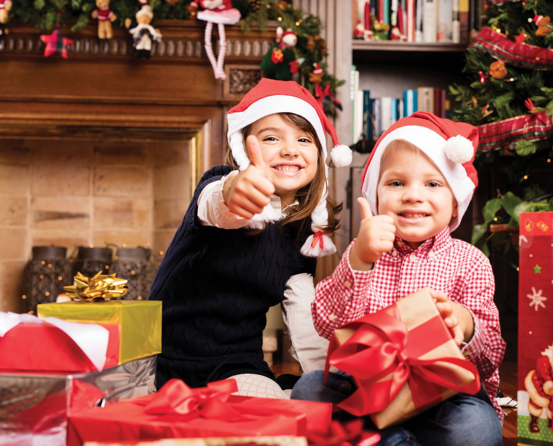 child under Christmas tree with a gift