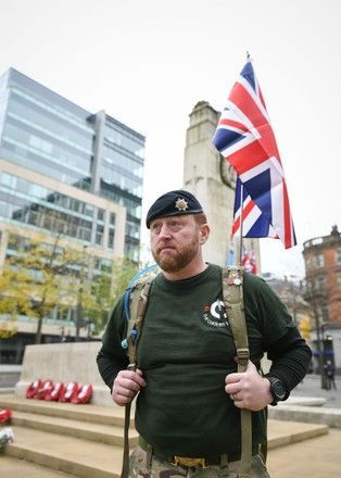 Uniformed security officer marching on patrol in central London, representing professional protection and high-visibility presence.