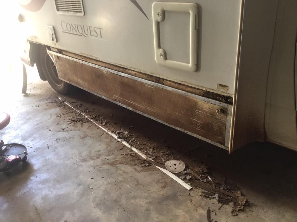 A White RV With the Word Conquest on the Side — Darwin Caravan & RV Centre In Berrimah, NT