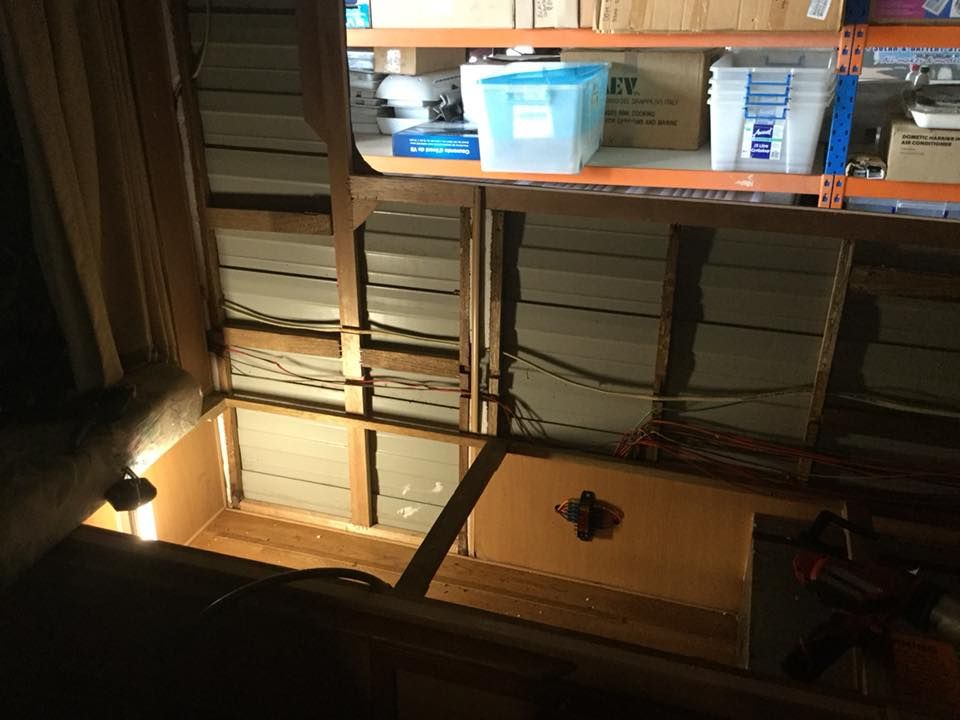 A Warehouse With Boxes on Shelves and a Box That Says Utility on It — Darwin Caravan & RV Centre In Berrimah, NT