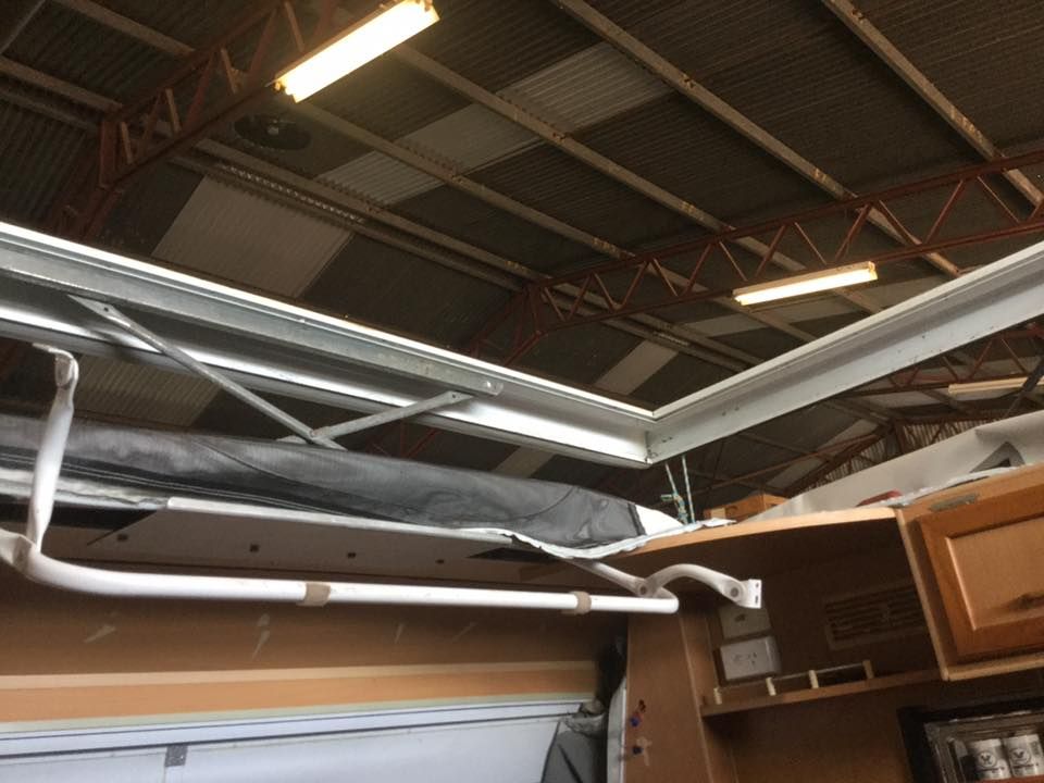 A Ceiling With a Ladder Hanging From It — Darwin Caravan & RV Centre In Berrimah, NT