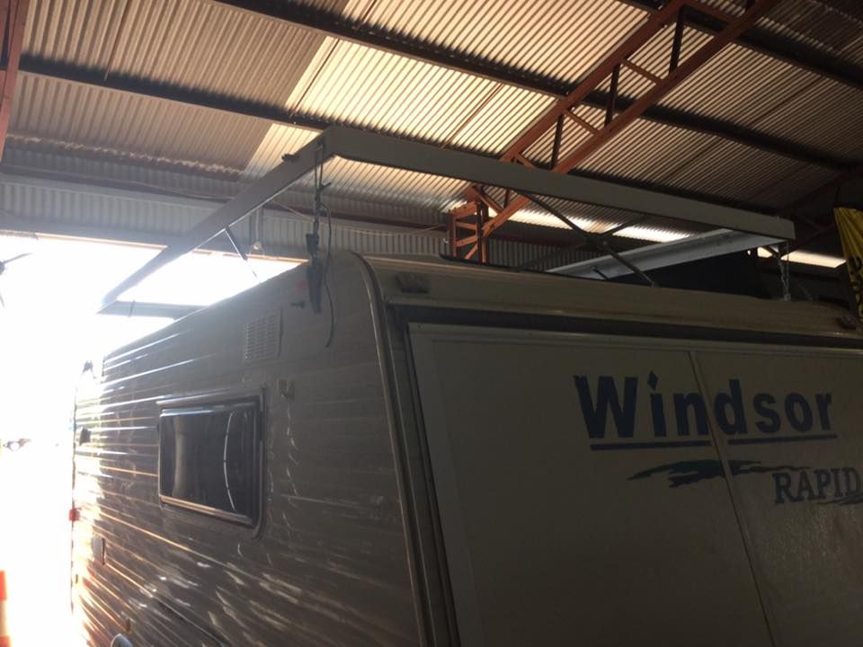 A Windsor RV is Parked in a Garage — Darwin Caravan & RV Centre In Palmerston, NT
