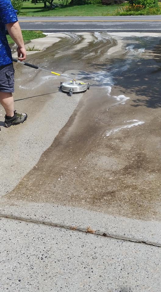 Man Washing the Dirty Driveway — Kingsport, TN — C&E Cleaning Services