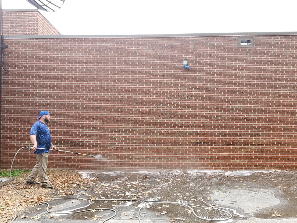 Man Pressure Washing the Concrete Floor — Kingsport, TN — C&E Cleaning Services