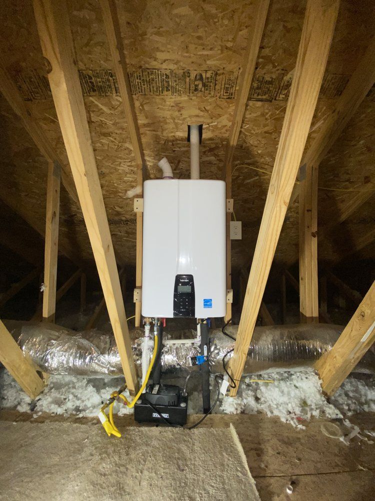 A water heater is installed in the attic of a house.