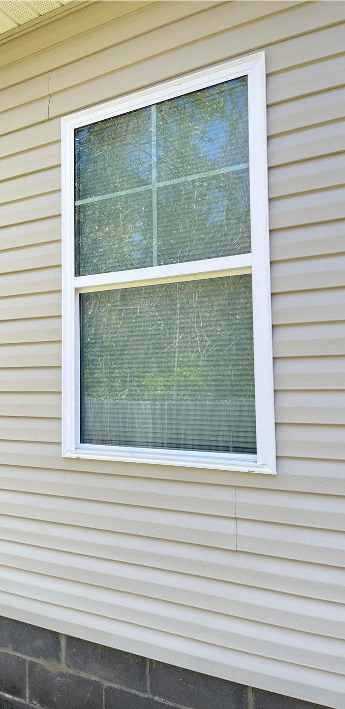 Power washing a house