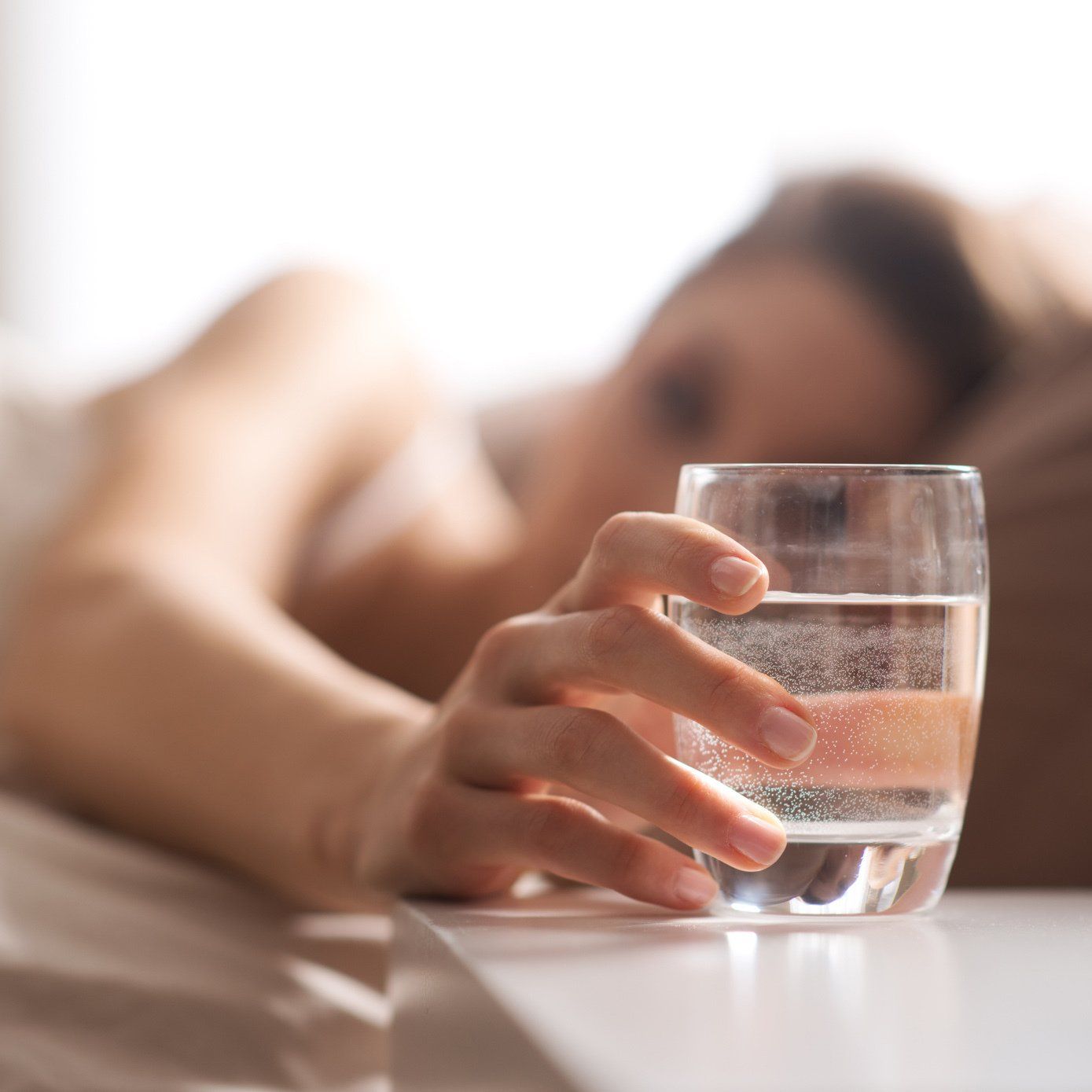 Woman in Bed Getting the Glass of Water — Orlando, FL — Florida Pure Water Solutions