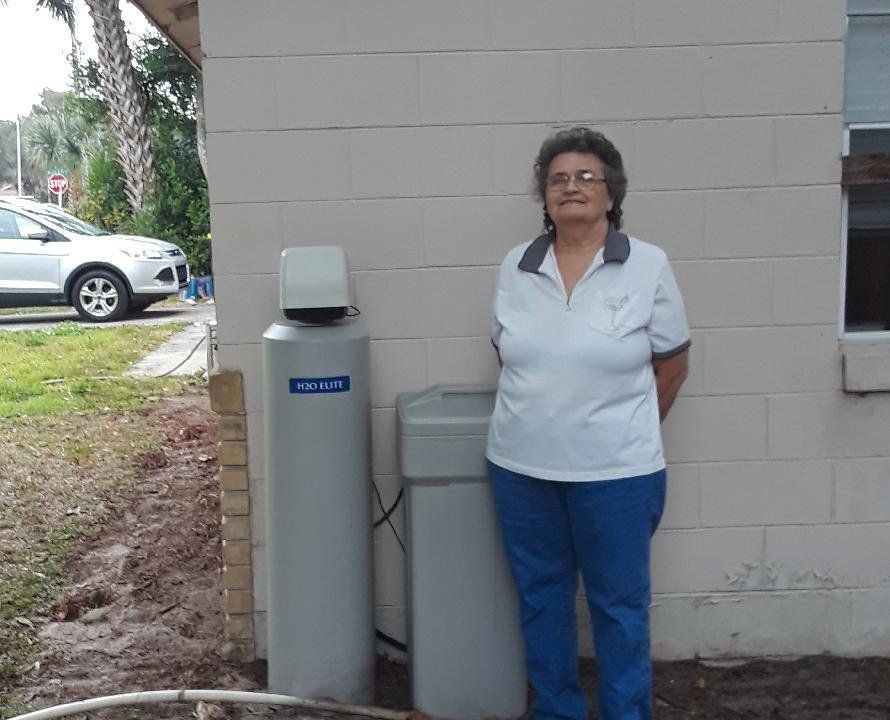 Woman and A Water Treatment — Orlando, FL — Florida Pure Water Solutions