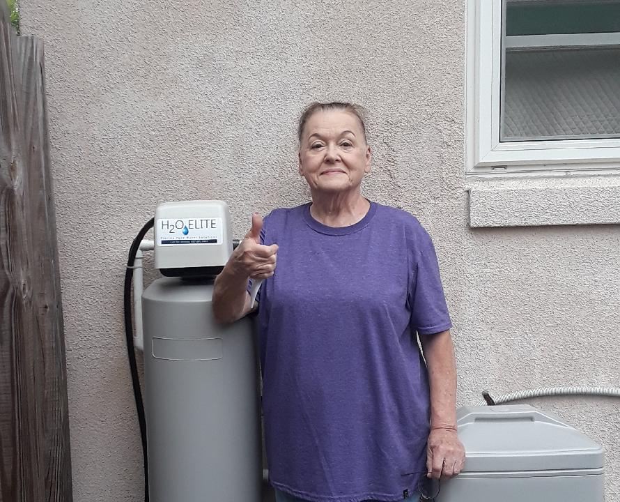 Woman Wearing a Violet Shirt — Orlando, FL — Florida Pure Water Solutions