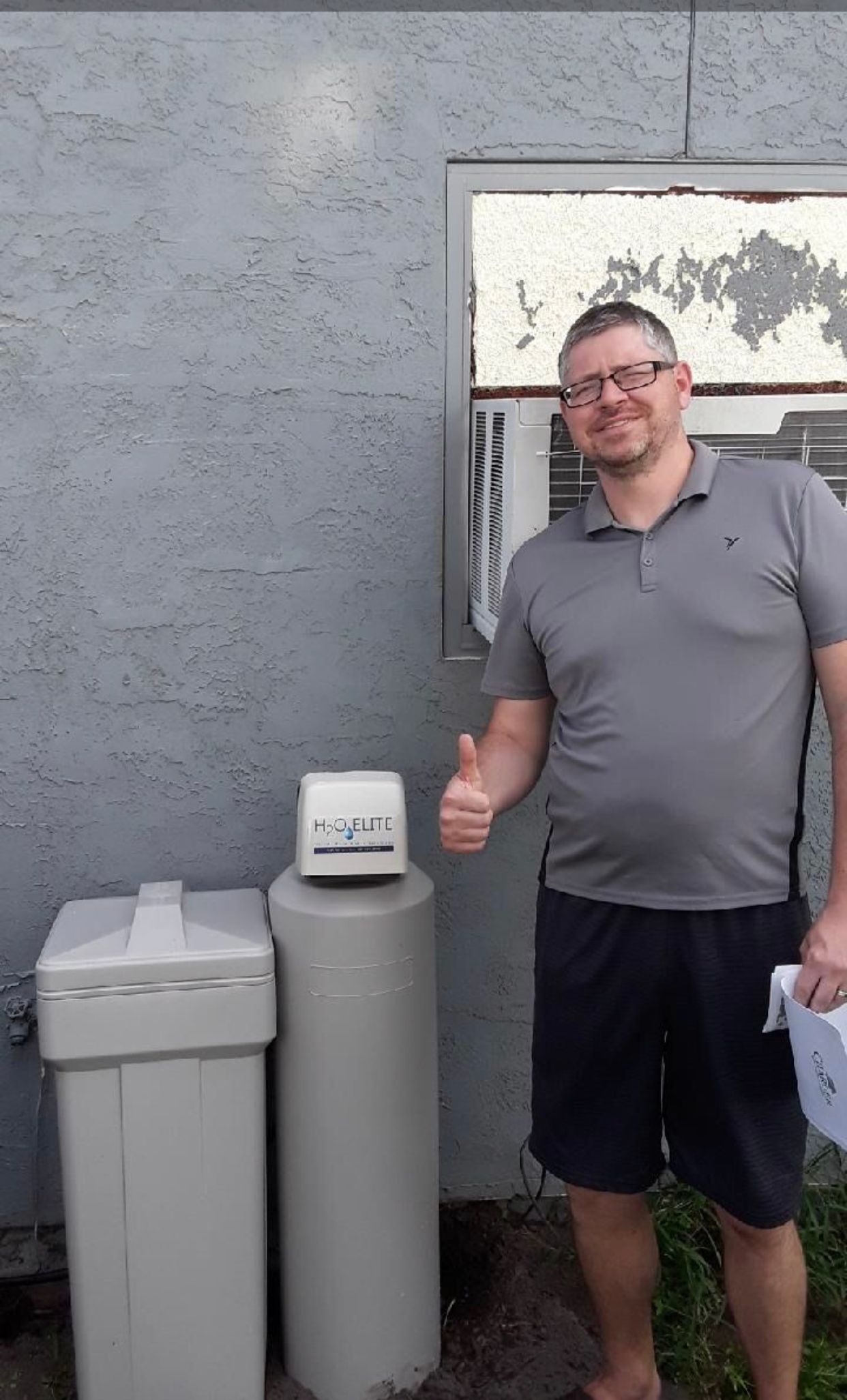 A Guy in Gray Shirt and Pure Water Filtration System — Orlando, FL — Florida Pure Water Solutions