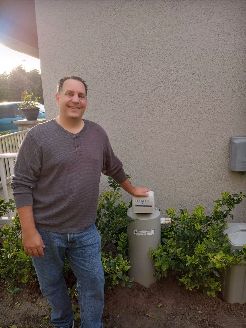 Man and a Water Filter — Orlando, FL — Florida Pure Water Solutions