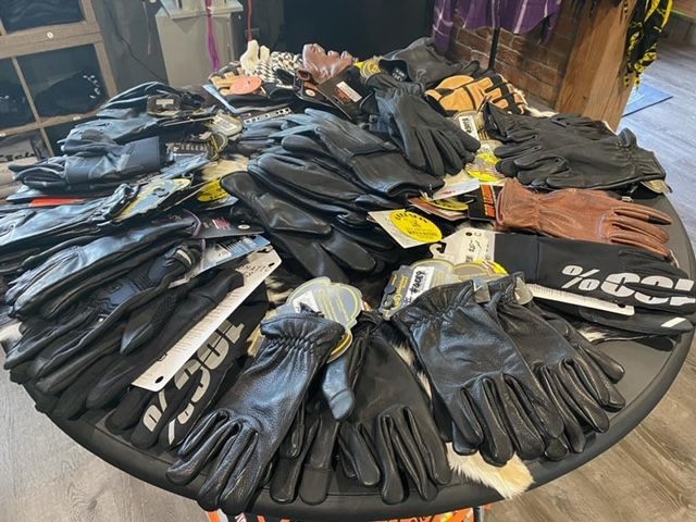 A table with a bunch of gloves on it | Holt, MO| Re-Cycle Gear
